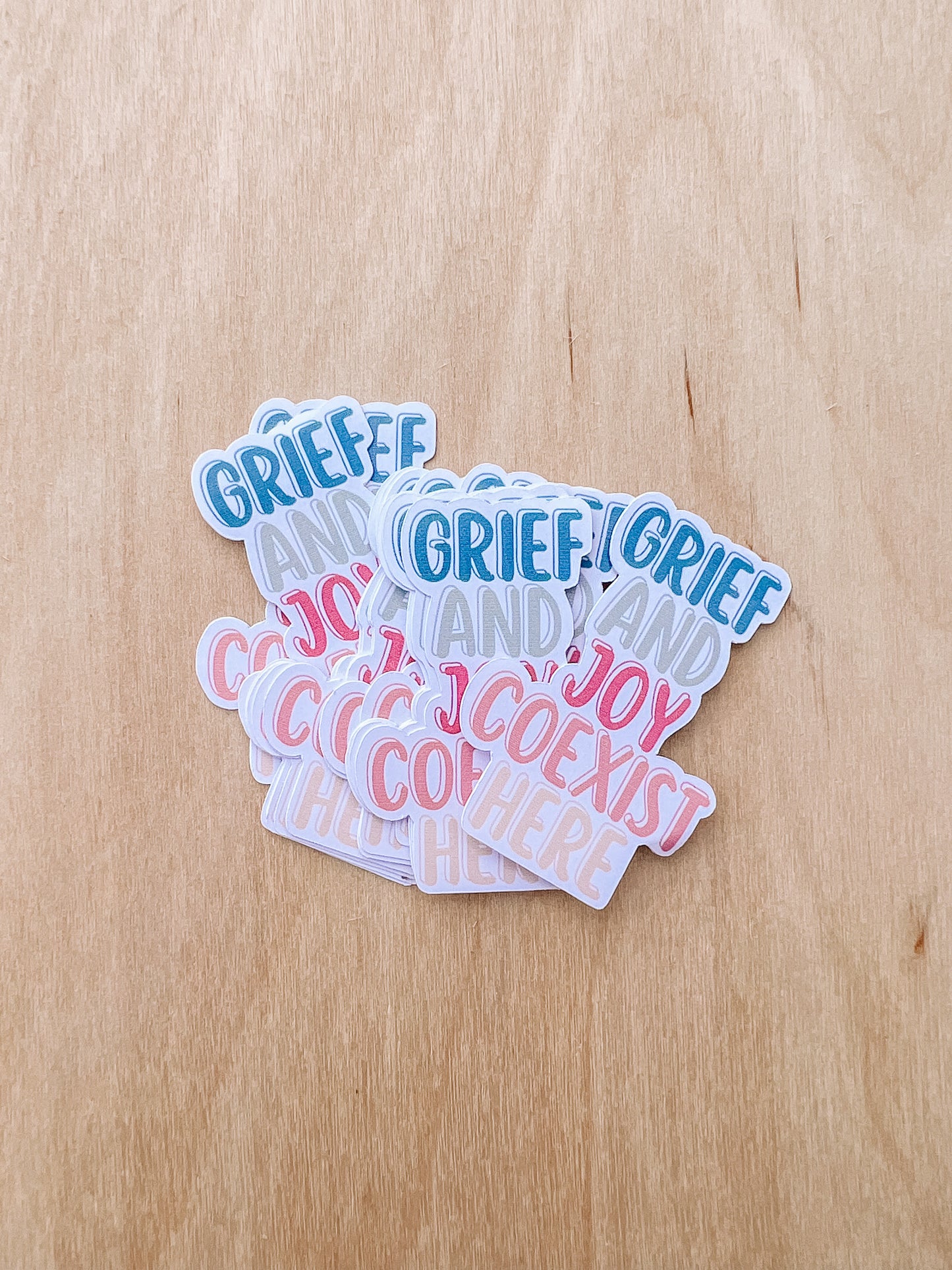 GRIEF AND JOY COEXIST HERE STICKERS